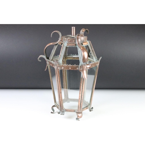 120 - Early 20th century Arts & Crafts glazed copper lantern, of hexagonal form, raised on four scrolling ... 