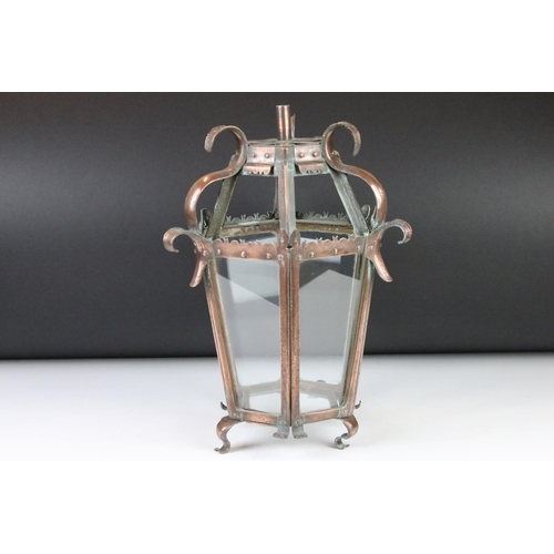 120 - Early 20th century Arts & Crafts glazed copper lantern, of hexagonal form, raised on four scrolling ... 