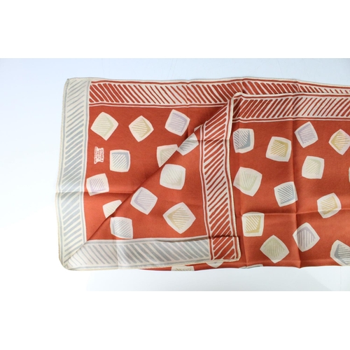 195 - 1960's Liberty of London Silk Scarf decorated with a stylised pattern on a burnt orange ground, 58.5... 