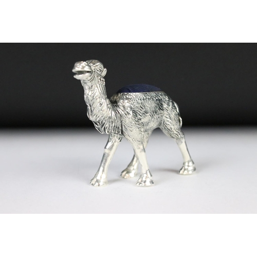 205 - A large silver plated camel style pincushion.