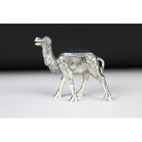 205 - A large silver plated camel style pincushion.