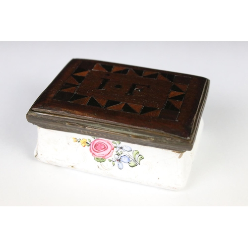 208 - An antique enamel trinket box with floral decoration an decoratively inlaid wooden lid, initialed I.... 