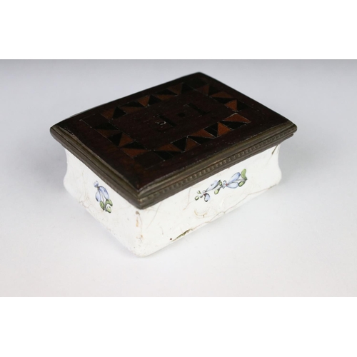 208 - An antique enamel trinket box with floral decoration an decoratively inlaid wooden lid, initialed I.... 