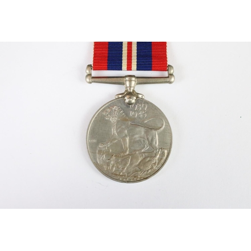 266 - A pair of World War Two full size medals to a female recipient to include the 1939-45 British war me... 