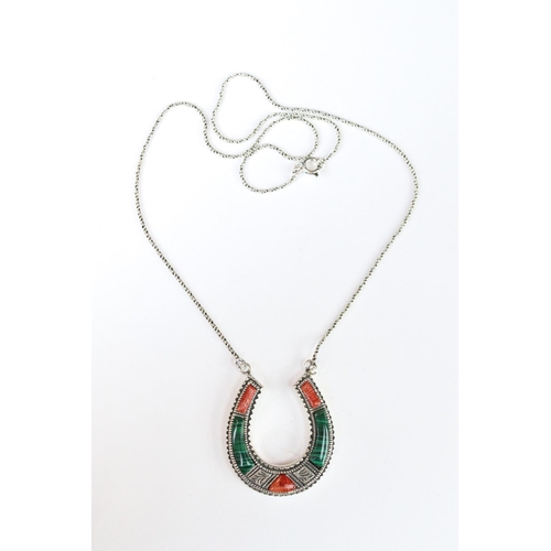 267 - A silver horseshoe shaped necklace set with malachite and agate.