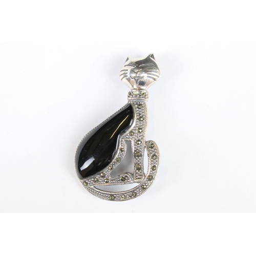 269 - A silver marcasite and onyx cat brooch.