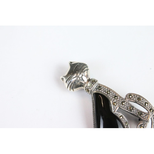 269 - A silver marcasite and onyx cat brooch.