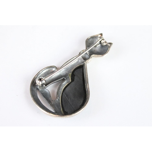 269 - A silver marcasite and onyx cat brooch.