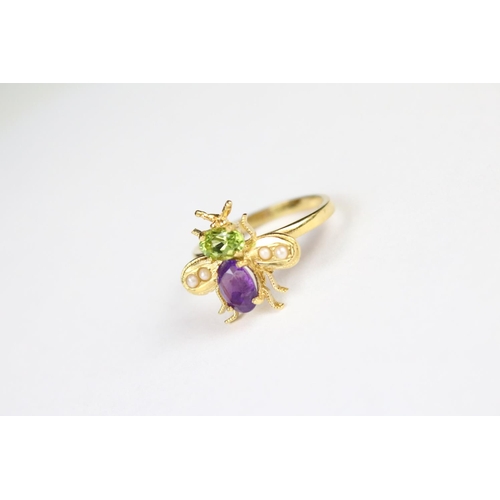 272 - A gold plated on silver bug ring set with peridot and amethyst.