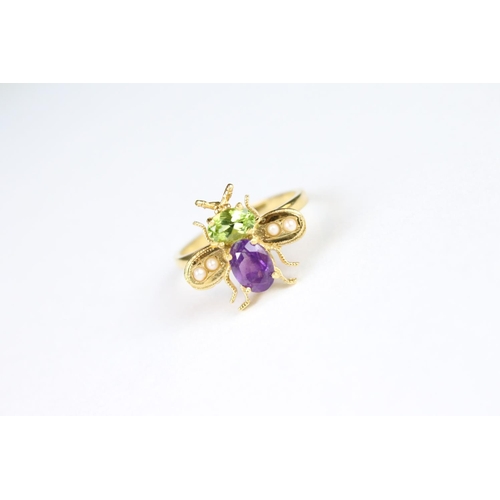 272 - A gold plated on silver bug ring set with peridot and amethyst.