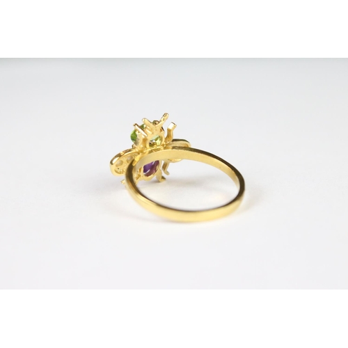 272 - A gold plated on silver bug ring set with peridot and amethyst.