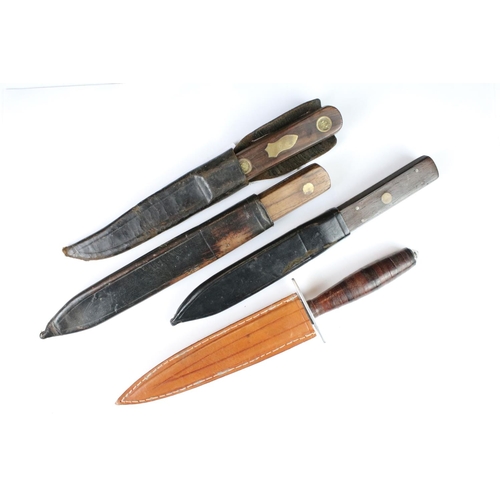 273 - Two Green River Company knives, a Bushman knife and another knife, all complete with leather sheaths