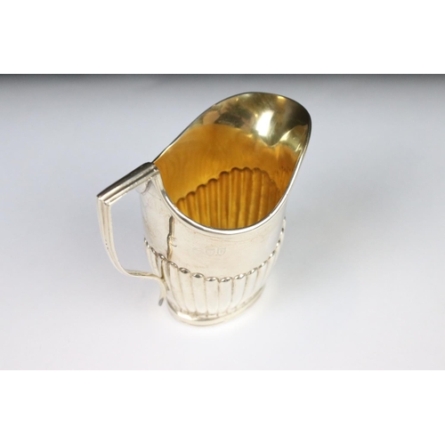 278 - A fully hallmarked sterling silver cream jug, assay marked for London.