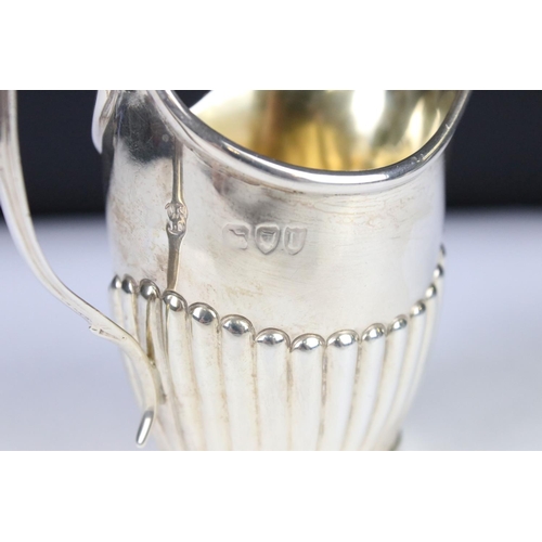 278 - A fully hallmarked sterling silver cream jug, assay marked for London.