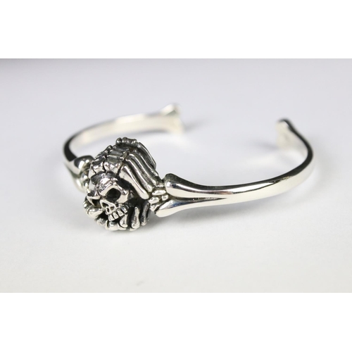 279 - A silver skeleton style bangle.