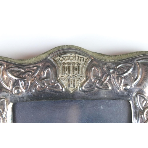 281 - A sterling silver photograph frame with decorative Celtic design, marked with the Dublin crest.