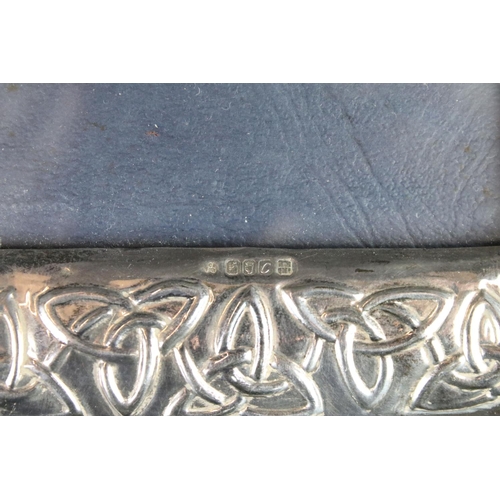 281 - A sterling silver photograph frame with decorative Celtic design, marked with the Dublin crest.