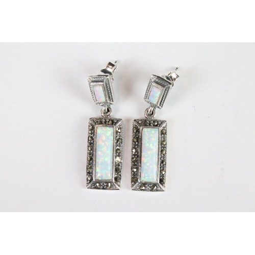 287 - A pair of silver marcasite and opal panelled art deco style earrings.