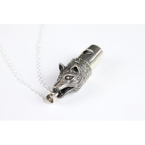 291 - A silver dog figural whistle on chain.