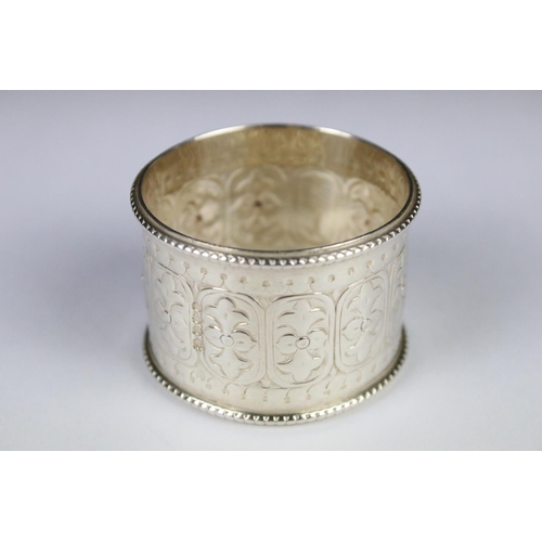 294 - A small collection of hallmarked silver to include spoons and napkin ring together with a silver pla... 