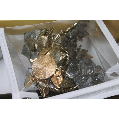 298 - A box of mixed collectables to include costume jewellery, cigar cutter, cigarette cards, silver plat... 