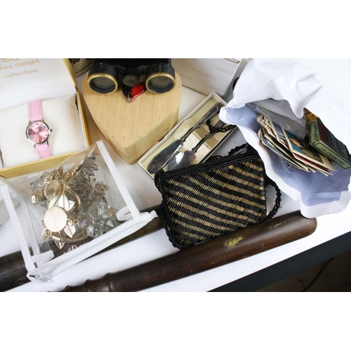 298 - A box of mixed collectables to include costume jewellery, cigar cutter, cigarette cards, silver plat... 