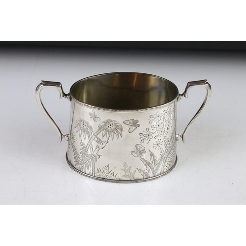 299 - An antique silver plated tea set to include teapot, water jug, cream jug and sugar bowl, all with fl... 