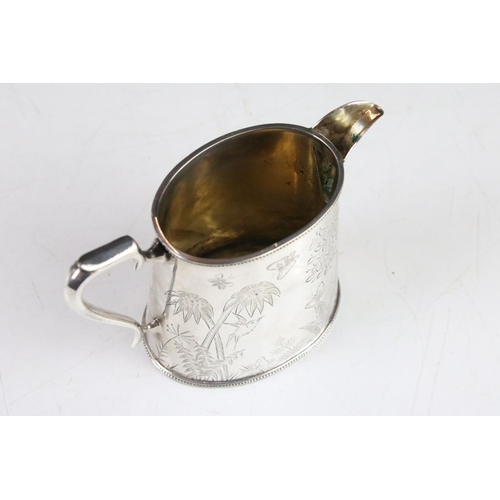 299 - An antique silver plated tea set to include teapot, water jug, cream jug and sugar bowl, all with fl... 