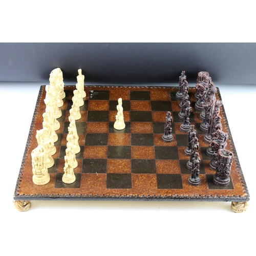 300 - A Wellington & Napoleon hand painted chess set together with chess board.