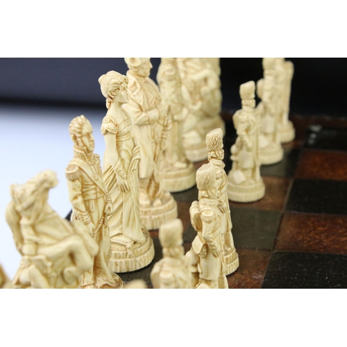 300 - A Wellington & Napoleon hand painted chess set together with chess board.