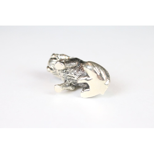 328 - A silver dog pincushion.