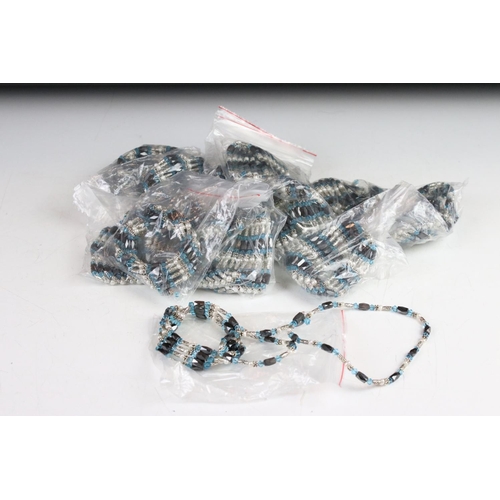 352 - A collection of Light blue six strand bracelets with magnetic fixings.