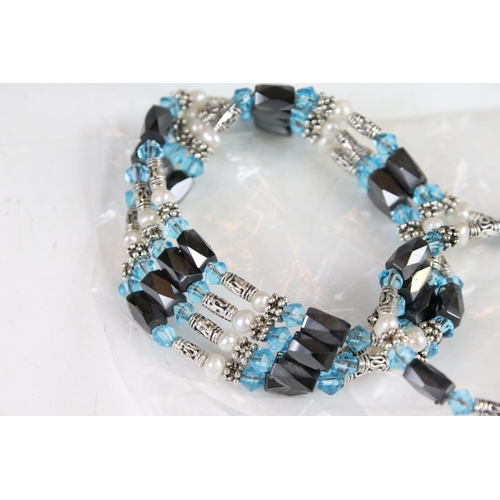 352 - A collection of Light blue six strand bracelets with magnetic fixings.