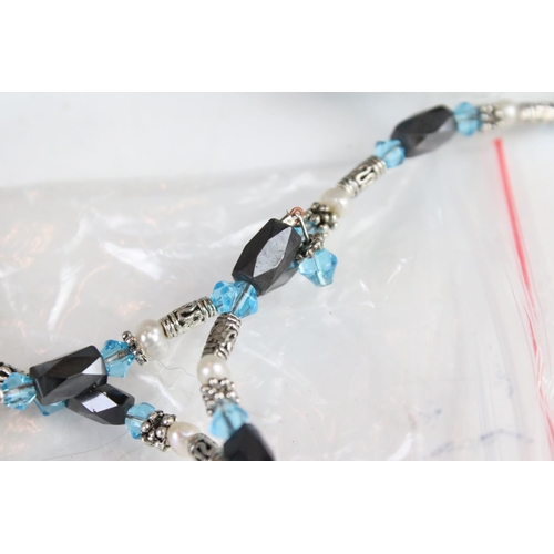 352 - A collection of Light blue six strand bracelets with magnetic fixings.
