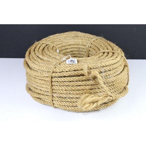 407 - A vintage ball of brown string together with a roll of rope.