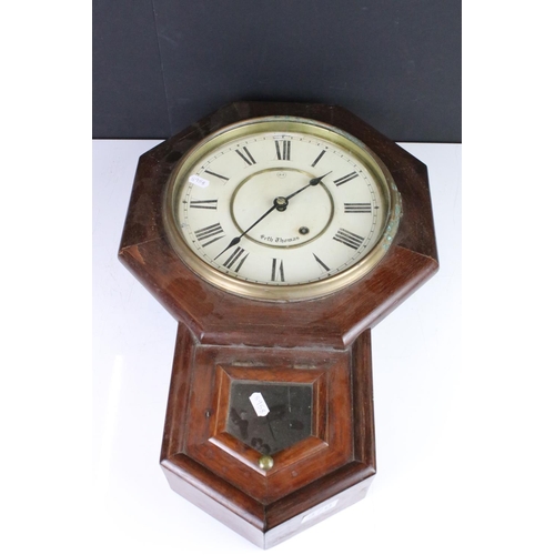 370 - A vintage wooden cased wall clock, the dial marked 'Seth Thomas'.