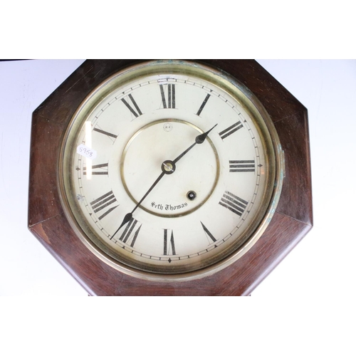 370 - A vintage wooden cased wall clock, the dial marked 'Seth Thomas'.