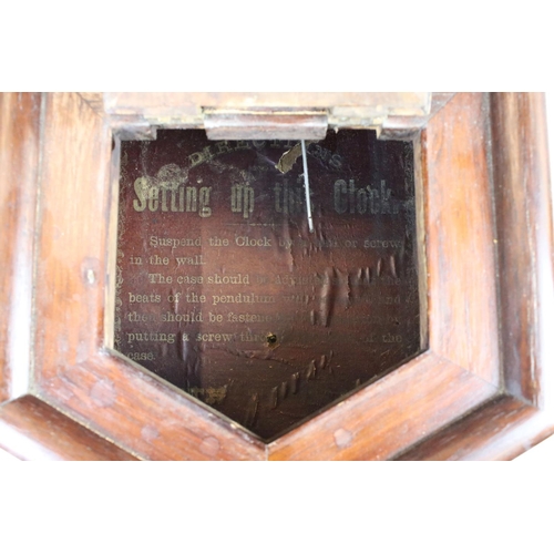 370 - A vintage wooden cased wall clock, the dial marked 'Seth Thomas'.