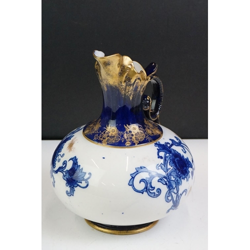 14 - Early 20th Century James Macintyre blue & white gilded jug, of squat baluster form, with floral deco... 