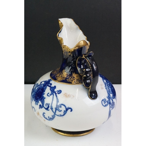 14 - Early 20th Century James Macintyre blue & white gilded jug, of squat baluster form, with floral deco... 