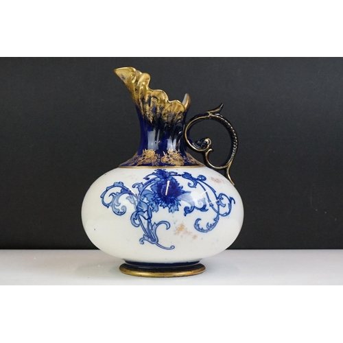 14 - Early 20th Century James Macintyre blue & white gilded jug, of squat baluster form, with floral deco... 