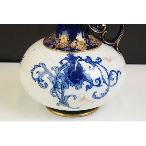 14 - Early 20th Century James Macintyre blue & white gilded jug, of squat baluster form, with floral deco... 