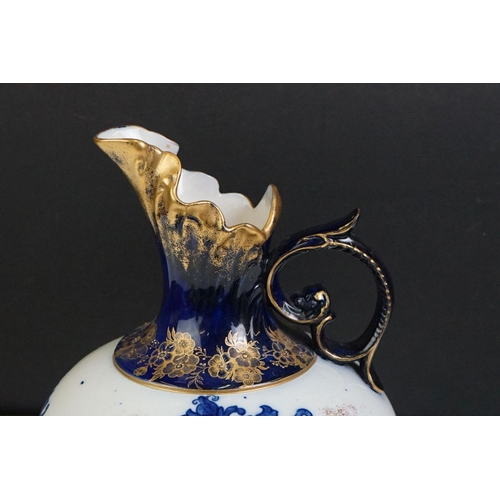 14 - Early 20th Century James Macintyre blue & white gilded jug, of squat baluster form, with floral deco... 