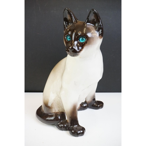 19 - Winstanley pottery model of a Seated Siamese Cat, with blue glass eyes, signed ' Kensington 32 Winst... 