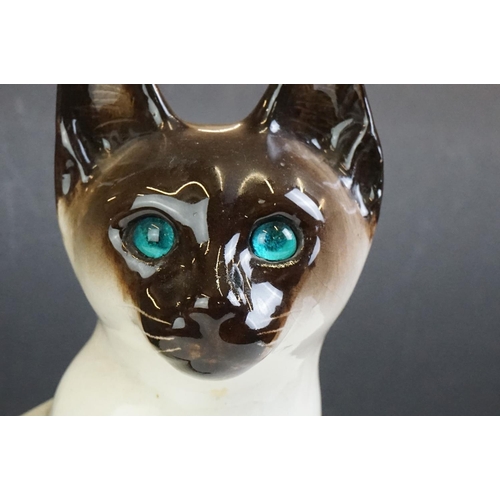 19 - Winstanley pottery model of a Seated Siamese Cat, with blue glass eyes, signed ' Kensington 32 Winst... 