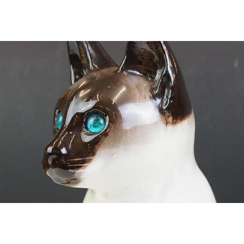 19 - Winstanley pottery model of a Seated Siamese Cat, with blue glass eyes, signed ' Kensington 32 Winst... 