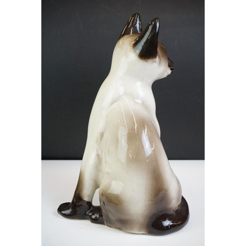 19 - Winstanley pottery model of a Seated Siamese Cat, with blue glass eyes, signed ' Kensington 32 Winst... 