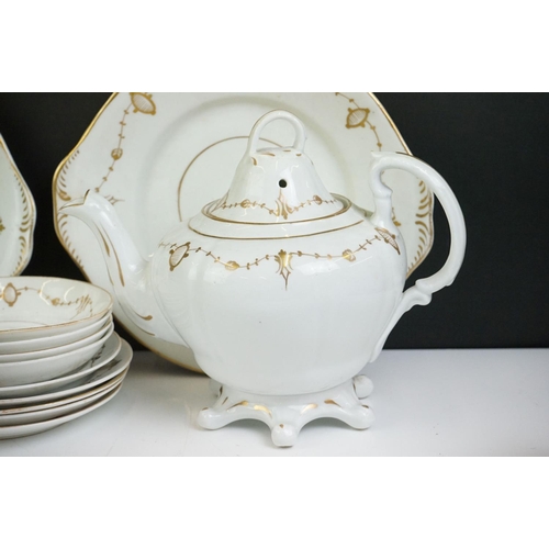 24 - 19th Century white ground & gilt tea set (teapot & cover, 7 teacups, 4 saucers, 5 tea plates, milk j... 