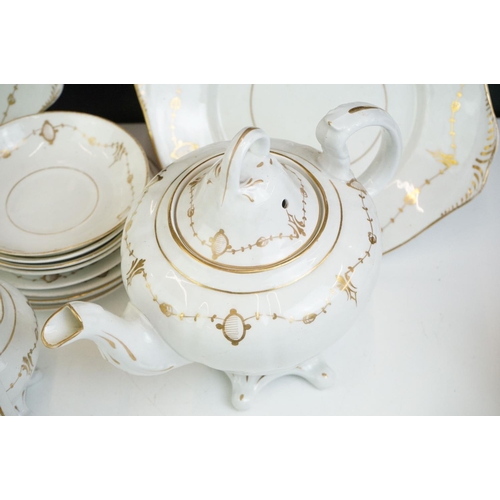 24 - 19th Century white ground & gilt tea set (teapot & cover, 7 teacups, 4 saucers, 5 tea plates, milk j... 