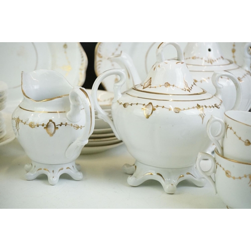 24 - 19th Century white ground & gilt tea set (teapot & cover, 7 teacups, 4 saucers, 5 tea plates, milk j... 